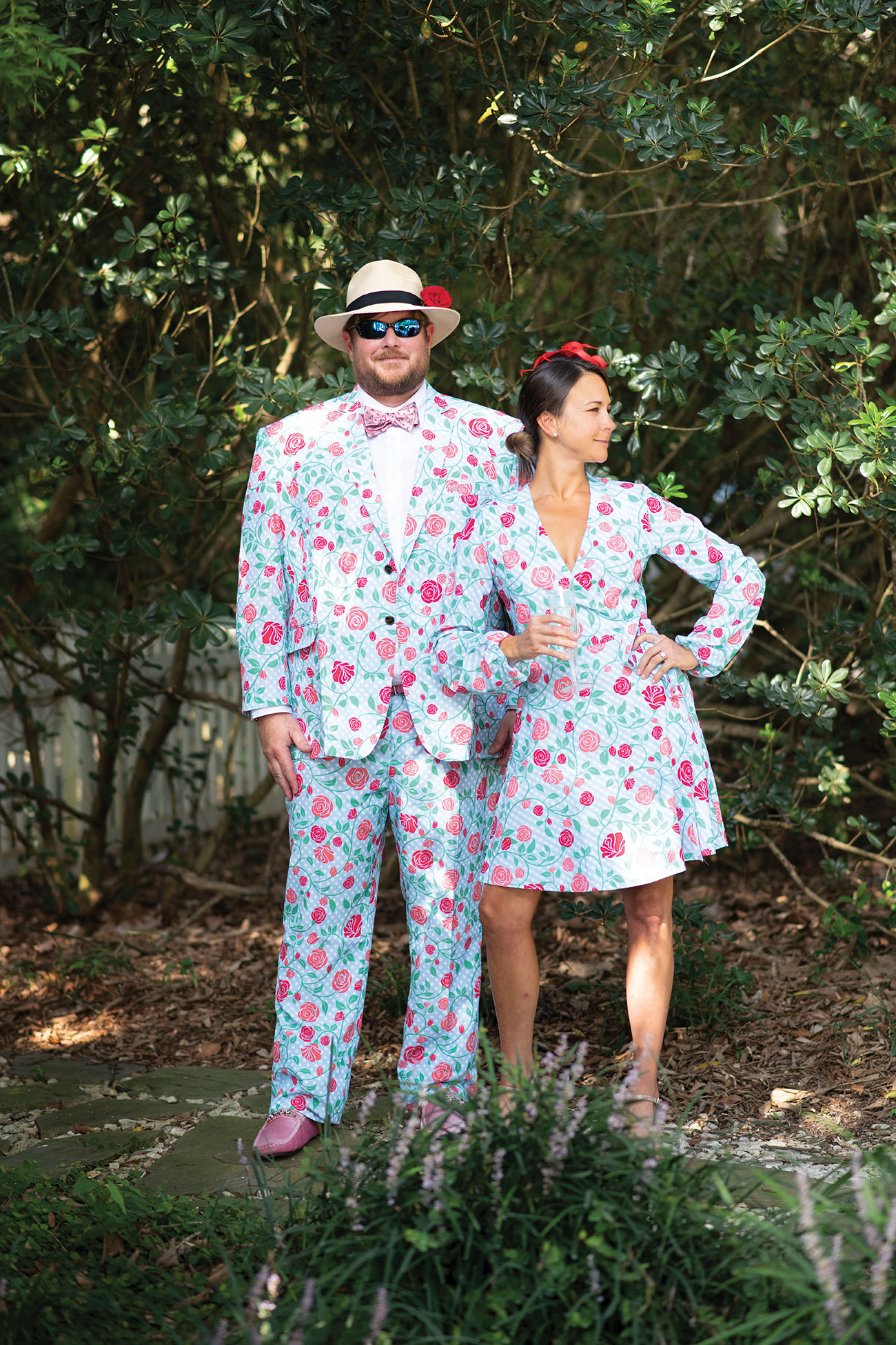 Man and woman posing in Kentucky Derby attire