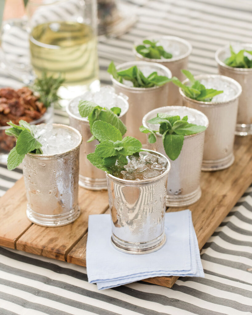 A table with mint Julep cups