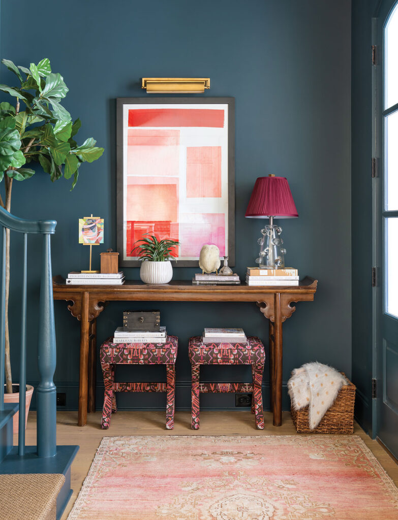 Foyer decorated with bold colors and abstract art