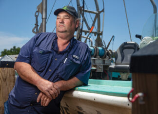 Portrait of Captain Morgan leaning on a boat