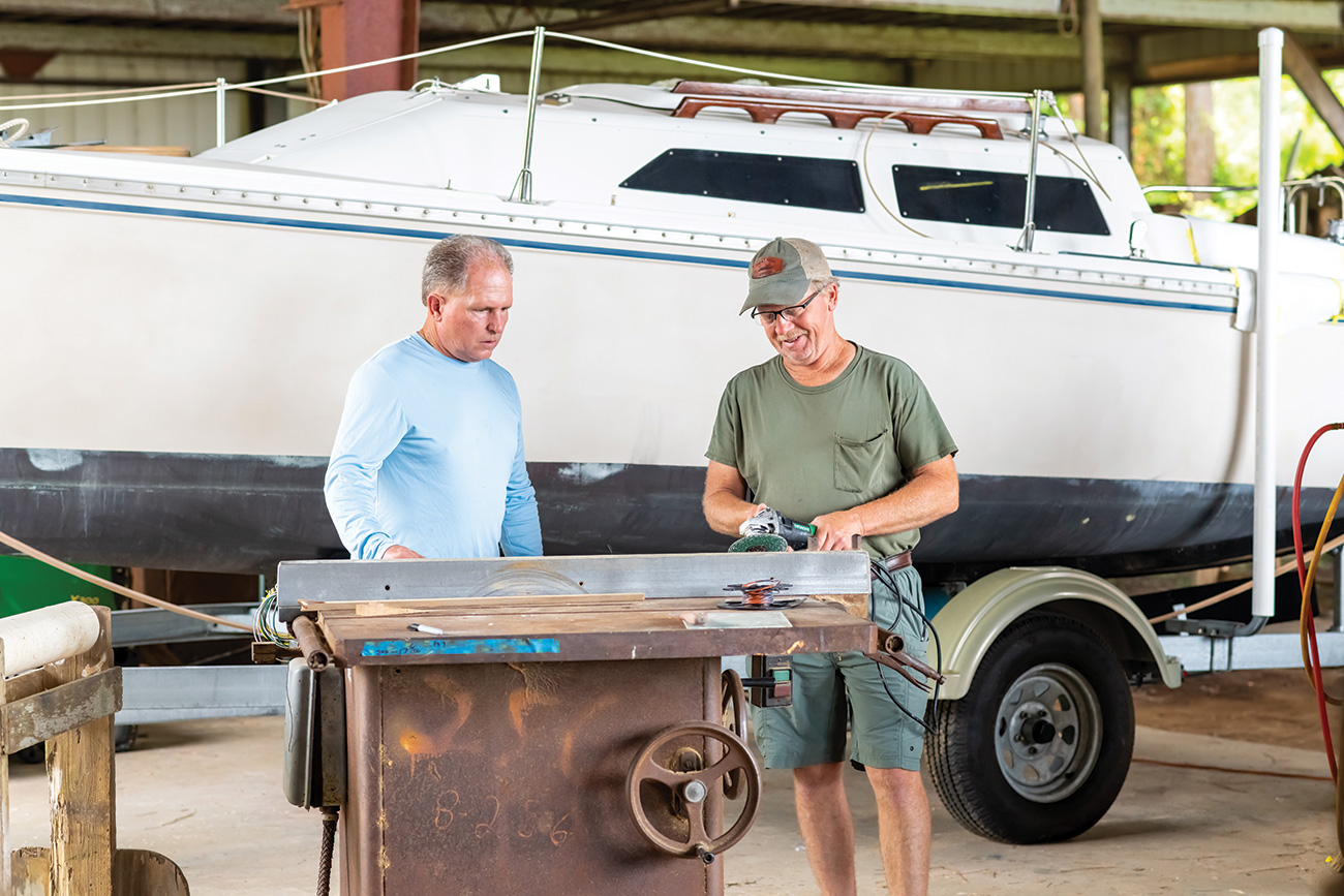 Two men working on a Resmondo boat