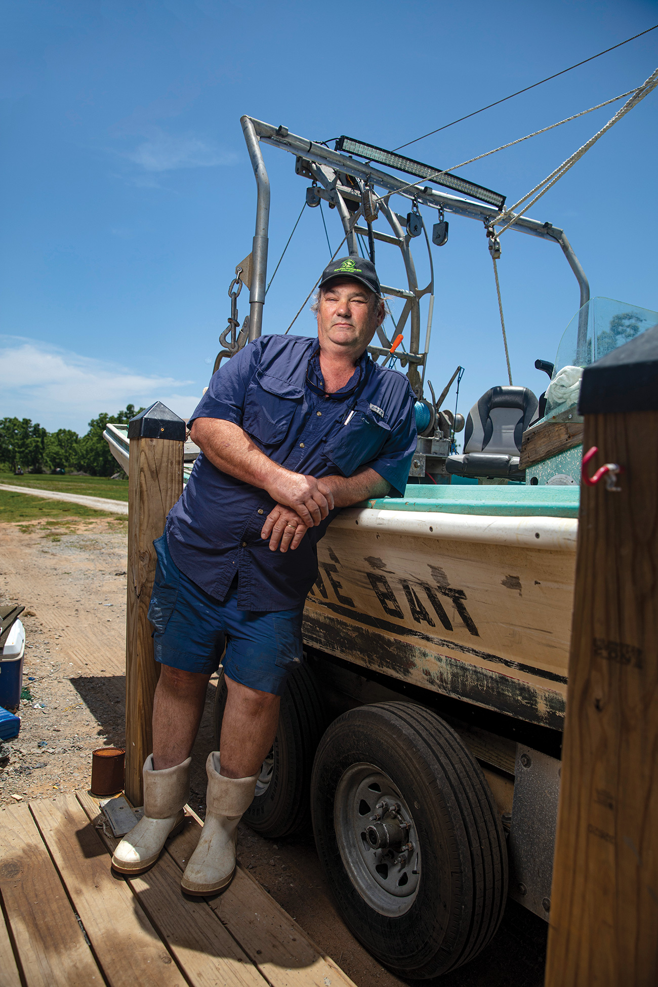 Portrait of Captain Morgan leaning against a boat