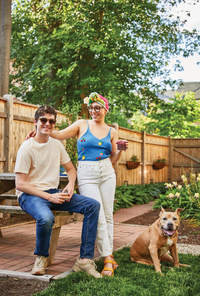 Lexi Mestas standing with her husband and dog