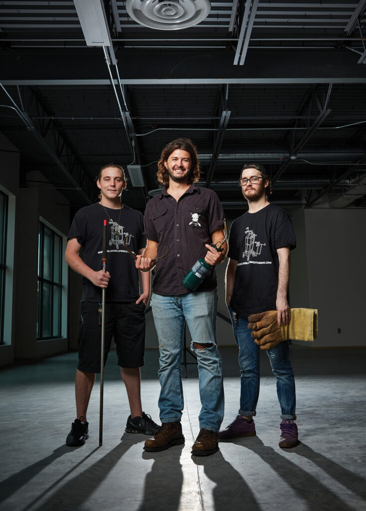 3 men of Muffinjaw Designs standing in warehouse