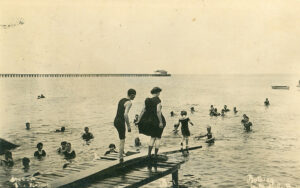 Old photo of swimmers enjoying Manure Wharf