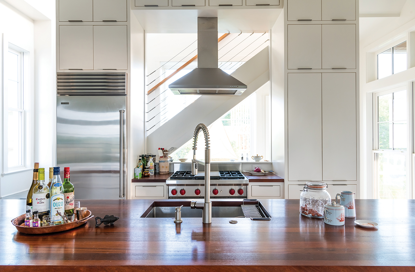 Pete J. Vallas' simplistic kitchen with stainless steal appliances and white cabinets