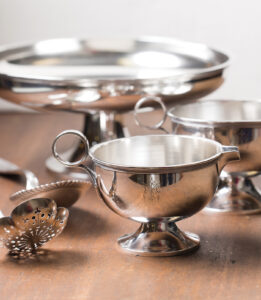 a collection of silver pieces