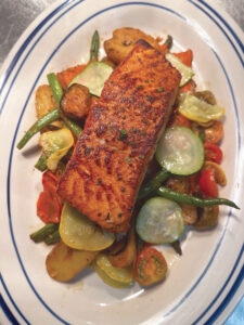Salmon over veggies at R Bistro in Fairhope, AL.