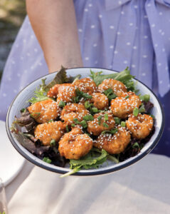 spicy saucy shrimp on a bed of greens