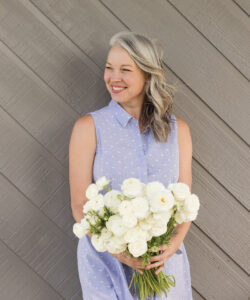 Kathy Gormandy holding flowers at P&K Farms