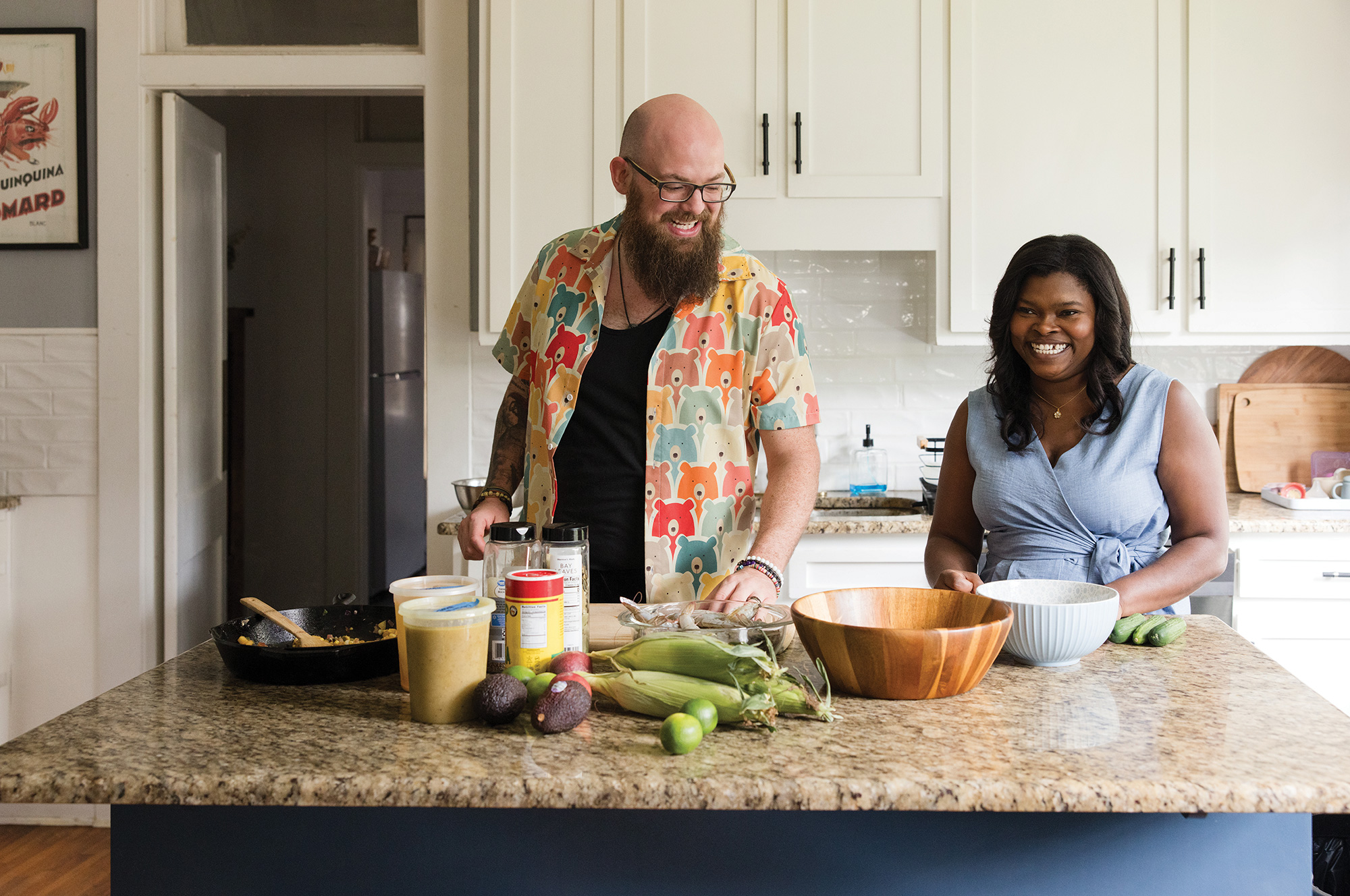 Rob Varner and his wife prep food at their kitchen island