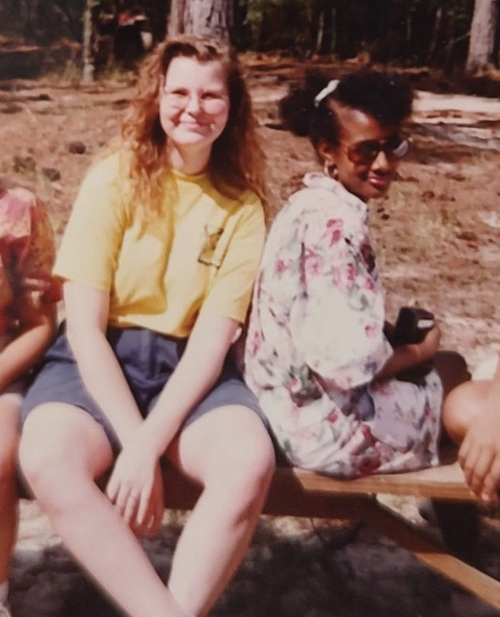 CC Nixon sits with a friend at Camp Rapahope