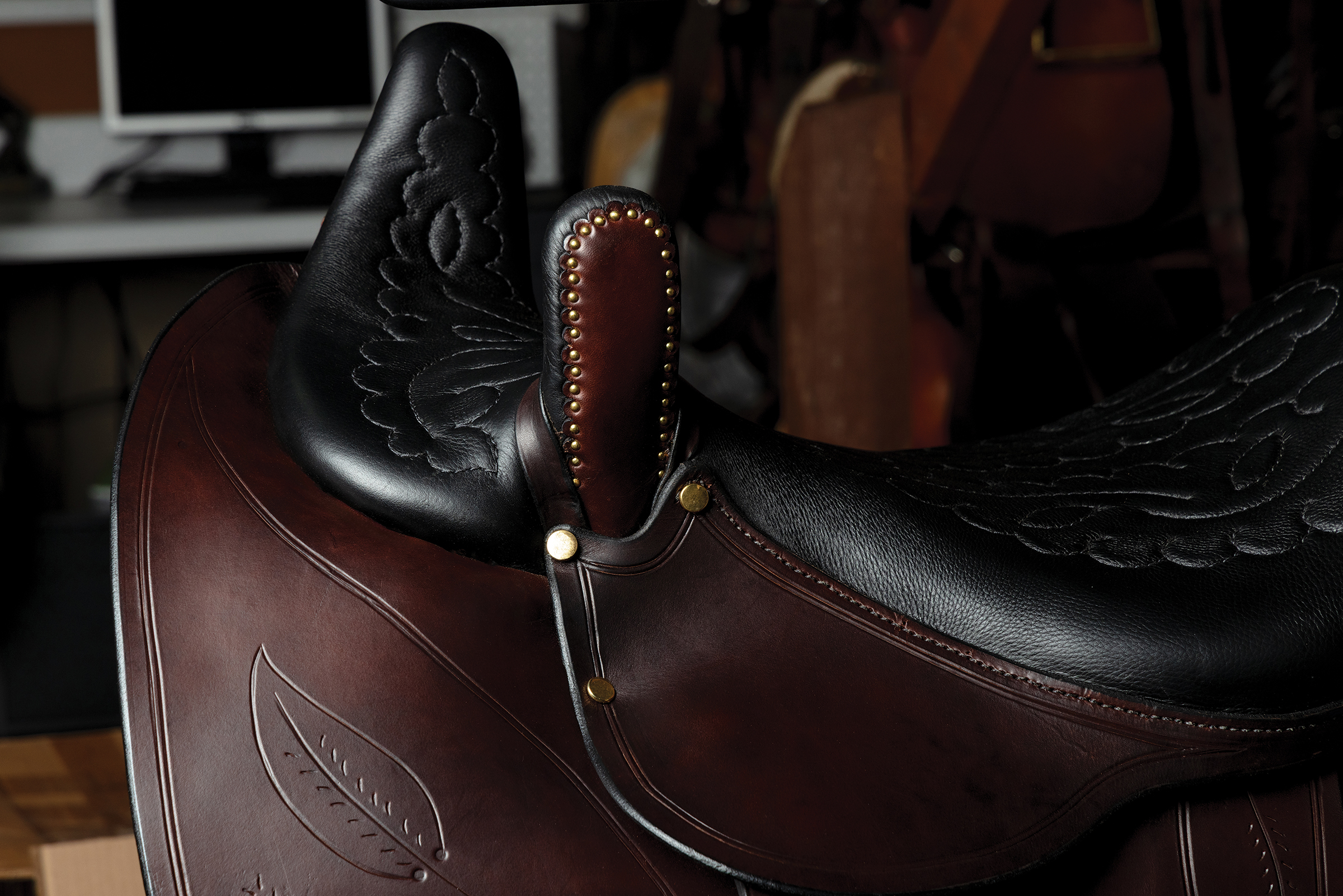 Upclose shot of the detail work on a saddle at The Saddle Guy workshop