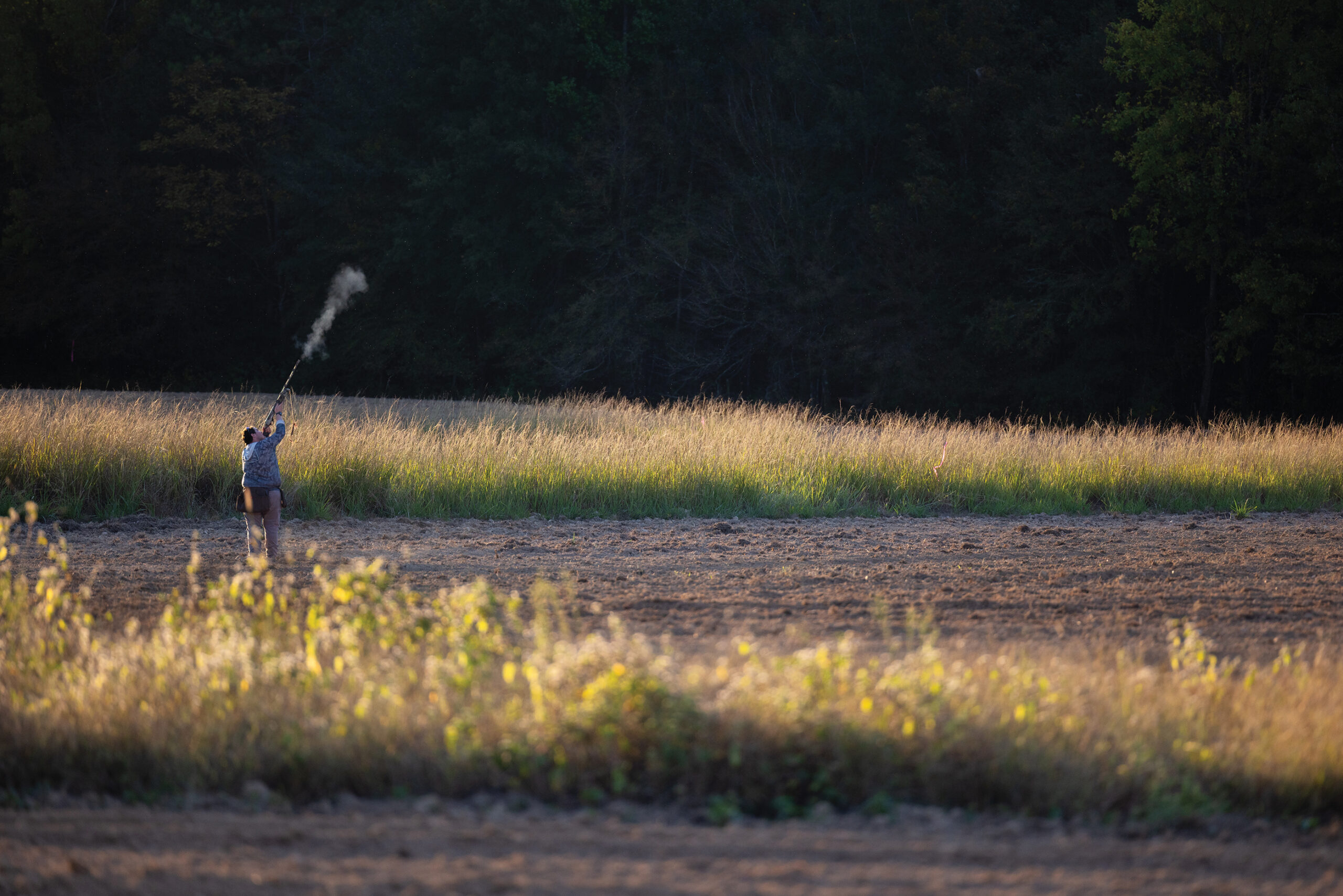 man shooting in field on a dove hunt