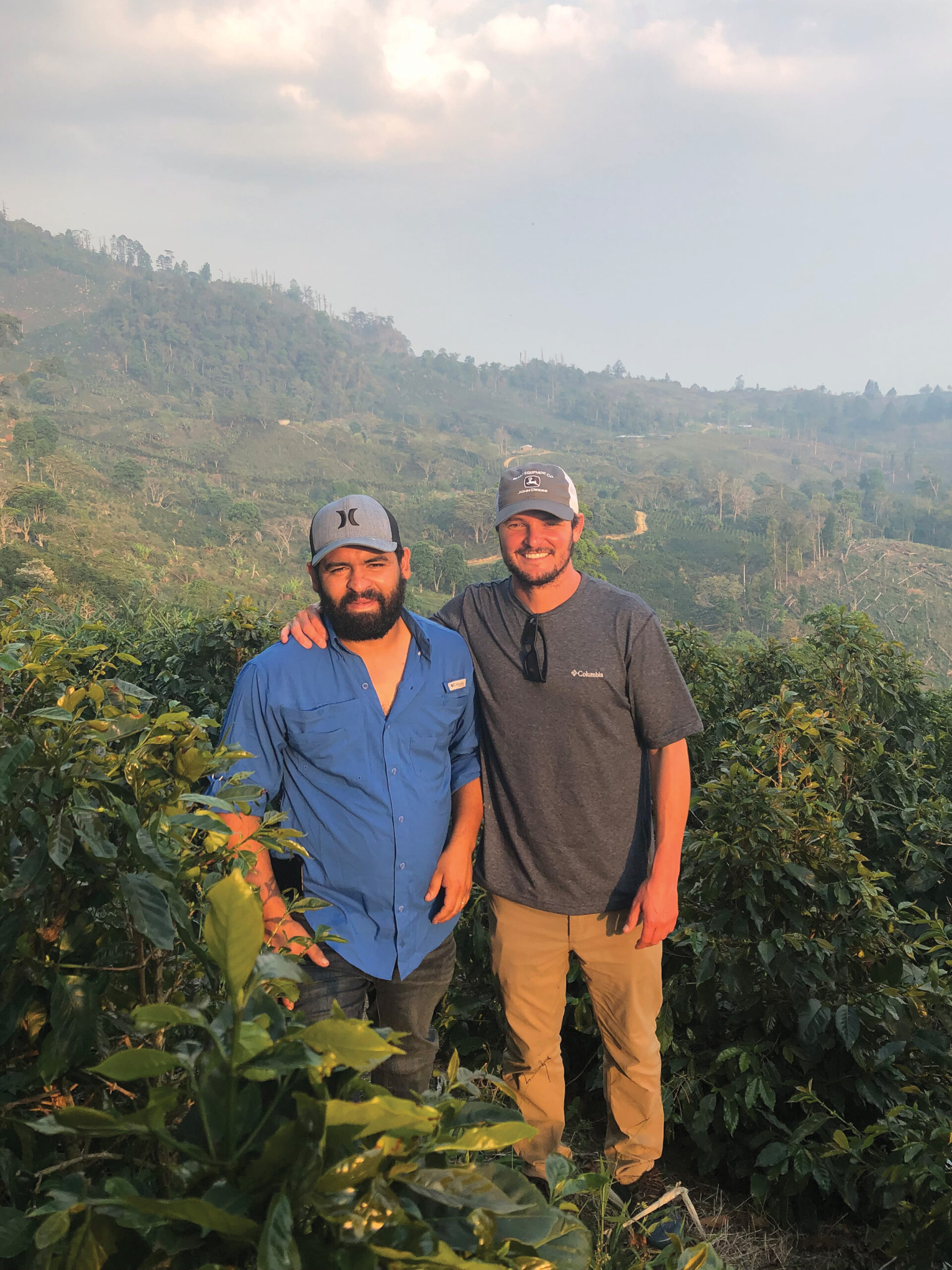 Richard Sanders and Cristobal Cerranza stand on a mountain in Honduras