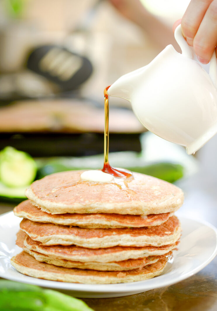 Syrup pouring on a stack of protein pancakes