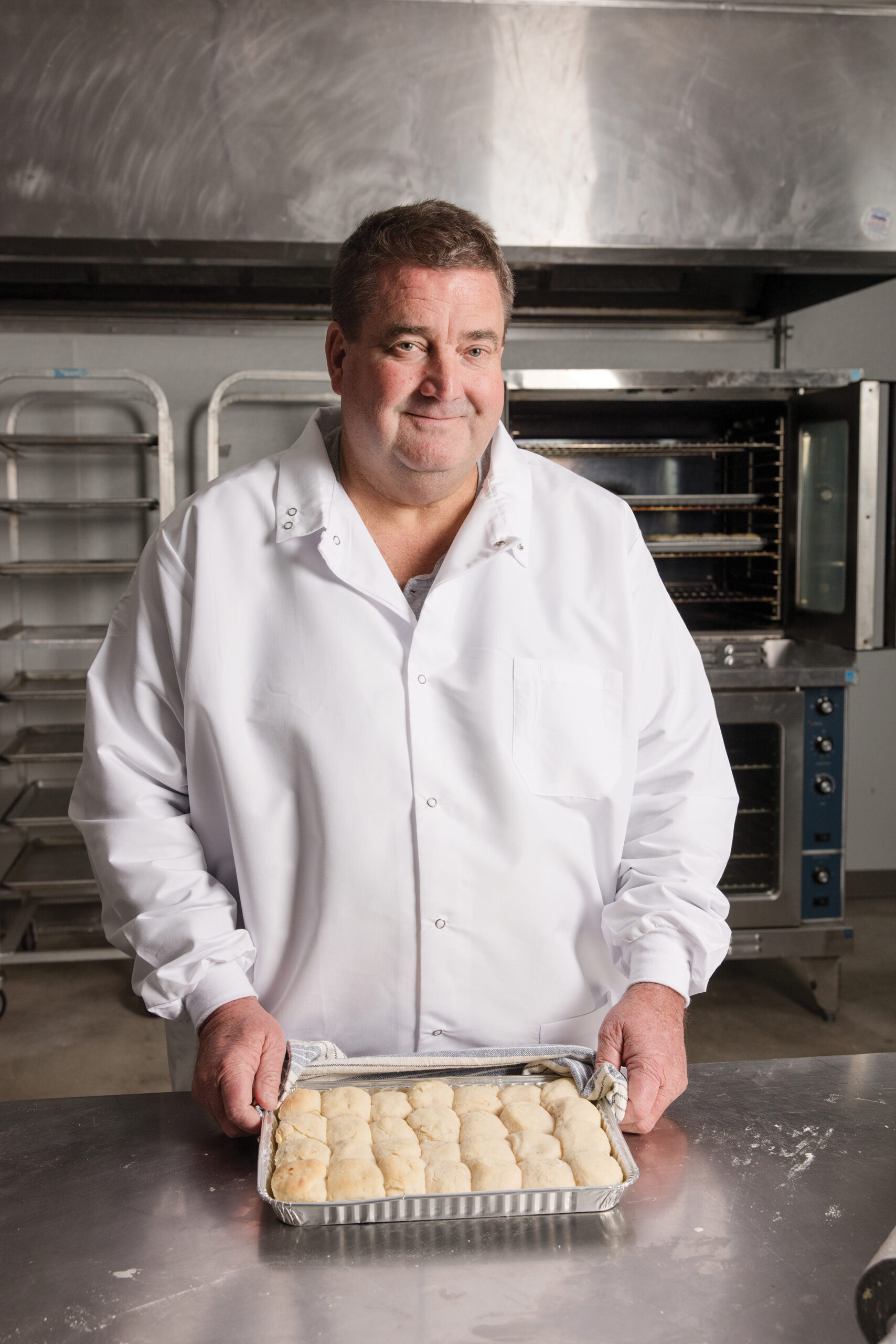 Stewart Thames holding a batch of biscuits