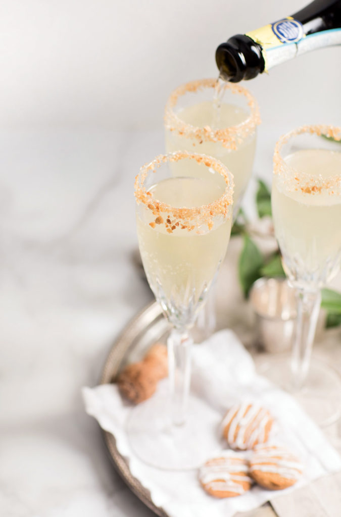 champagne cocktail glasses with crushed gingerbread on the rim